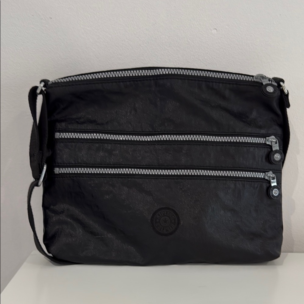 Kipling Black Messenger Bag with Durable Nylon and Water-Resistant Design